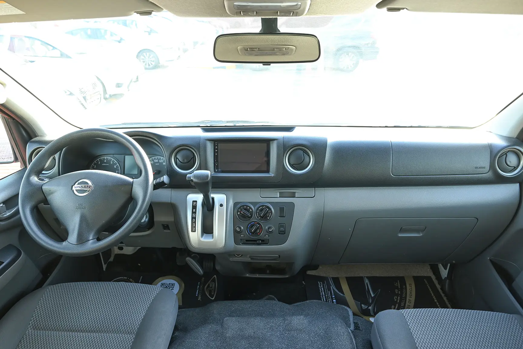 Used 2021 Nissan Urvan High Roof White – Front Cabin / Dashboard Full View at First Choice Cars Sharjah