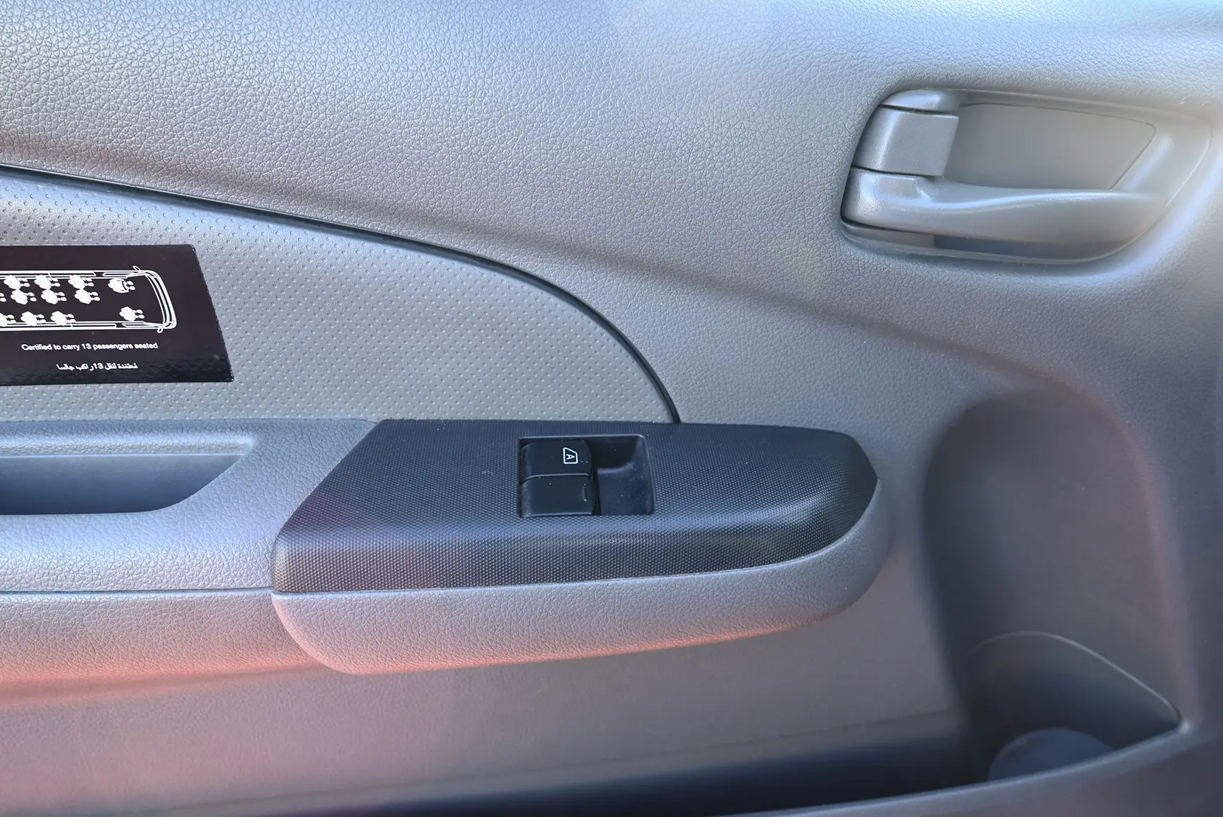 Used 2021 Nissan Urvan High Roof White – Driver Door Panel Full View at First Choice Cars Sharjah