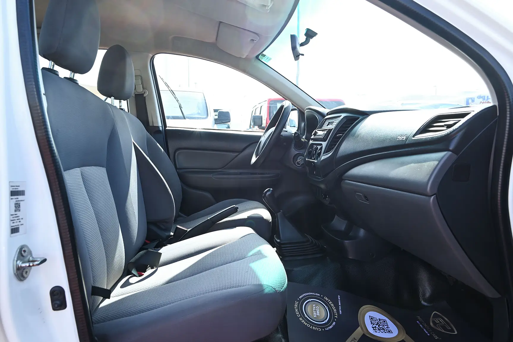 Used 2018 Mitsubishi L200 Double Cab GL White – Front Passenger Side Cabin View at First Choice Cars Sharjah