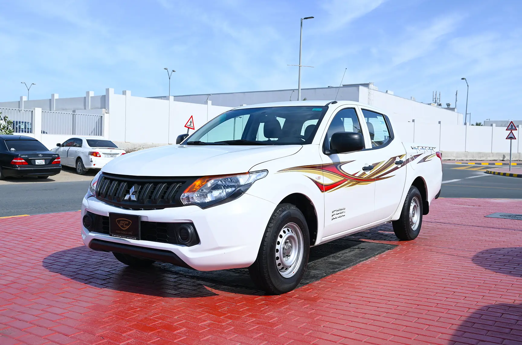 Used 2018 Mitsubishi L200 GL Double Cabin in White – Left Front Diagonal (45°) View for Sale at First Choice Cars Dubai Sharjah