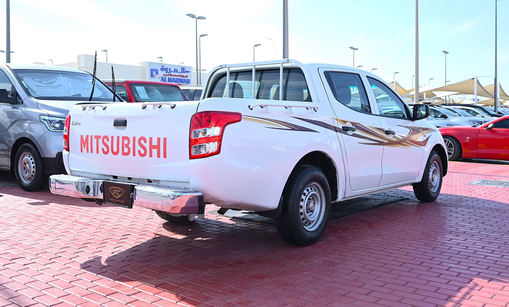 Used 2018 Mitsubishi L200 GL Double Cabin in White – Right Back Diagonal (45°) View for Sale at First Choice Cars Dubai Sharjah