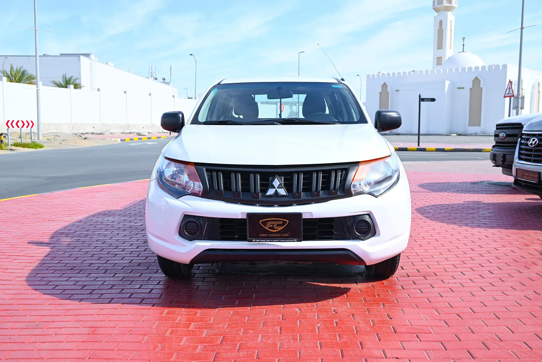 Used 2018 Mitsubishi L200 GL Double Cabin in White – Front View for Sale at First Choice Cars Dubai Sharjah