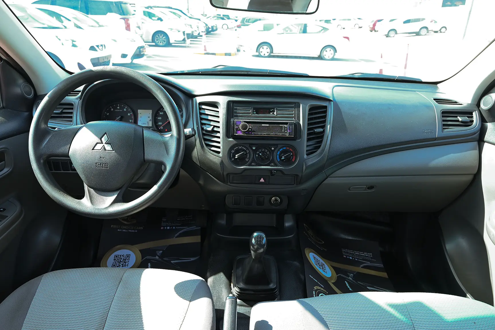 Used 2018 Mitsubishi L200 GL Double Cabin in White – Front Cabin / Dashboard Full View for Sale at First Choice Cars Dubai Sharjah