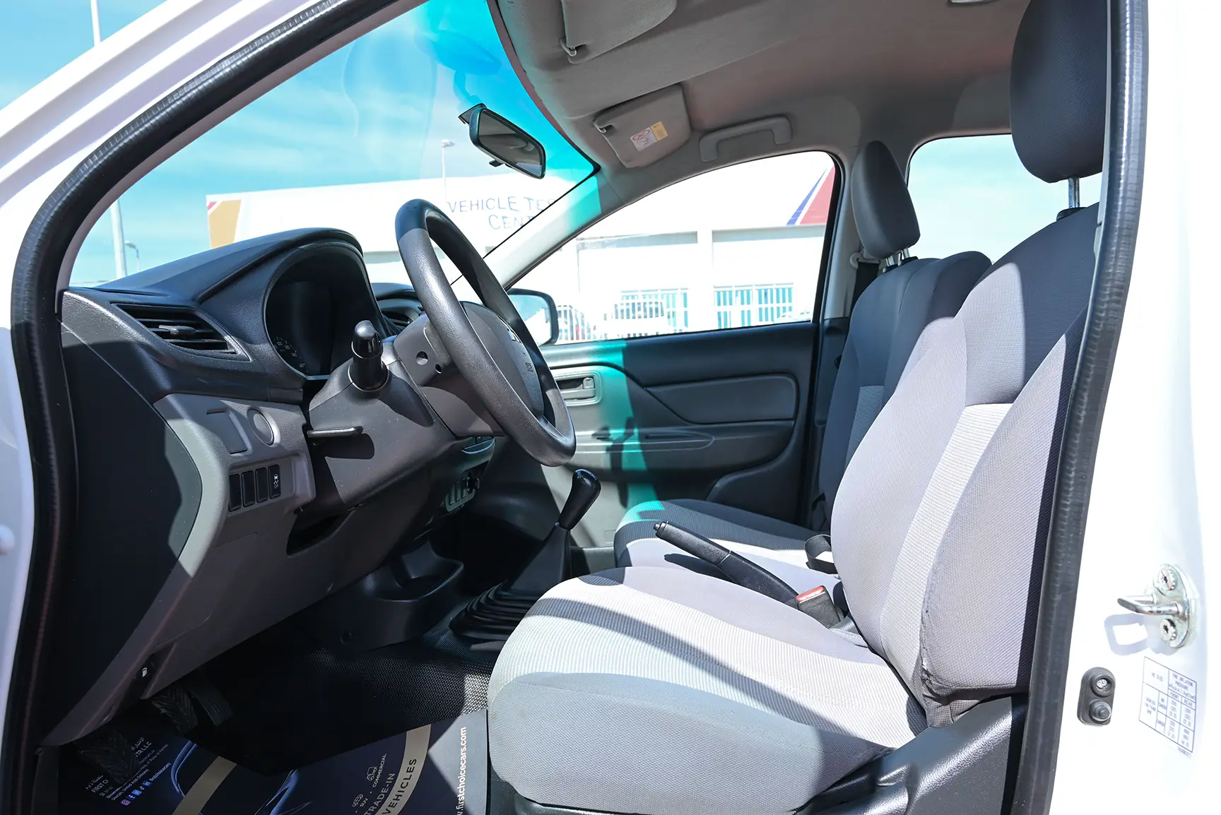Used 2018 Mitsubishi L200 GL Double Cabin in White – Front Driver Side Cabin View for Sale at First Choice Cars Dubai Sharjah