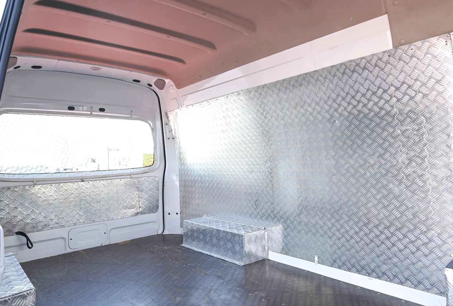 Used 2016 Nissan Urvan High Roof White – Delivery Box Right Side Interior View at First Choice Cars Sharjah