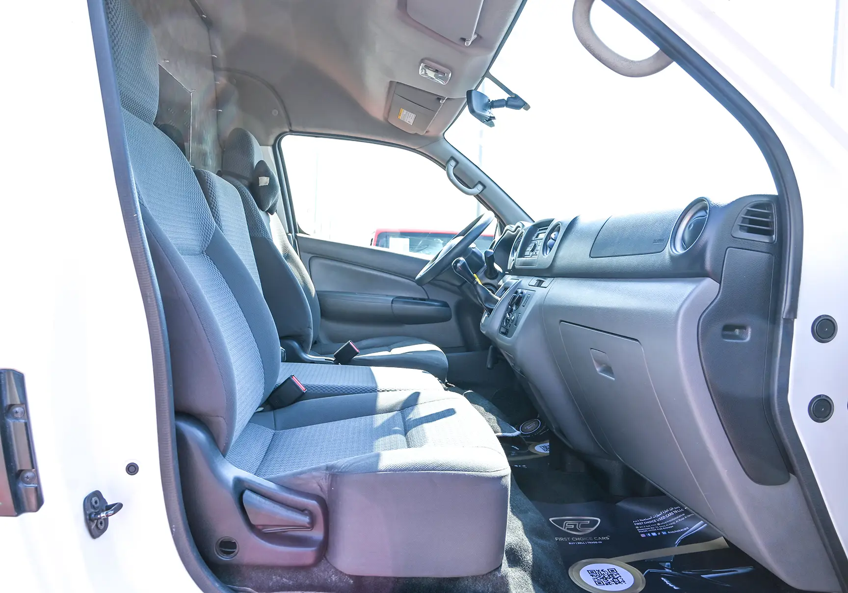 Used 2016 Nissan Urvan High Roof White – Front Passenger Side Cabin View at First Choice Cars Sharjah