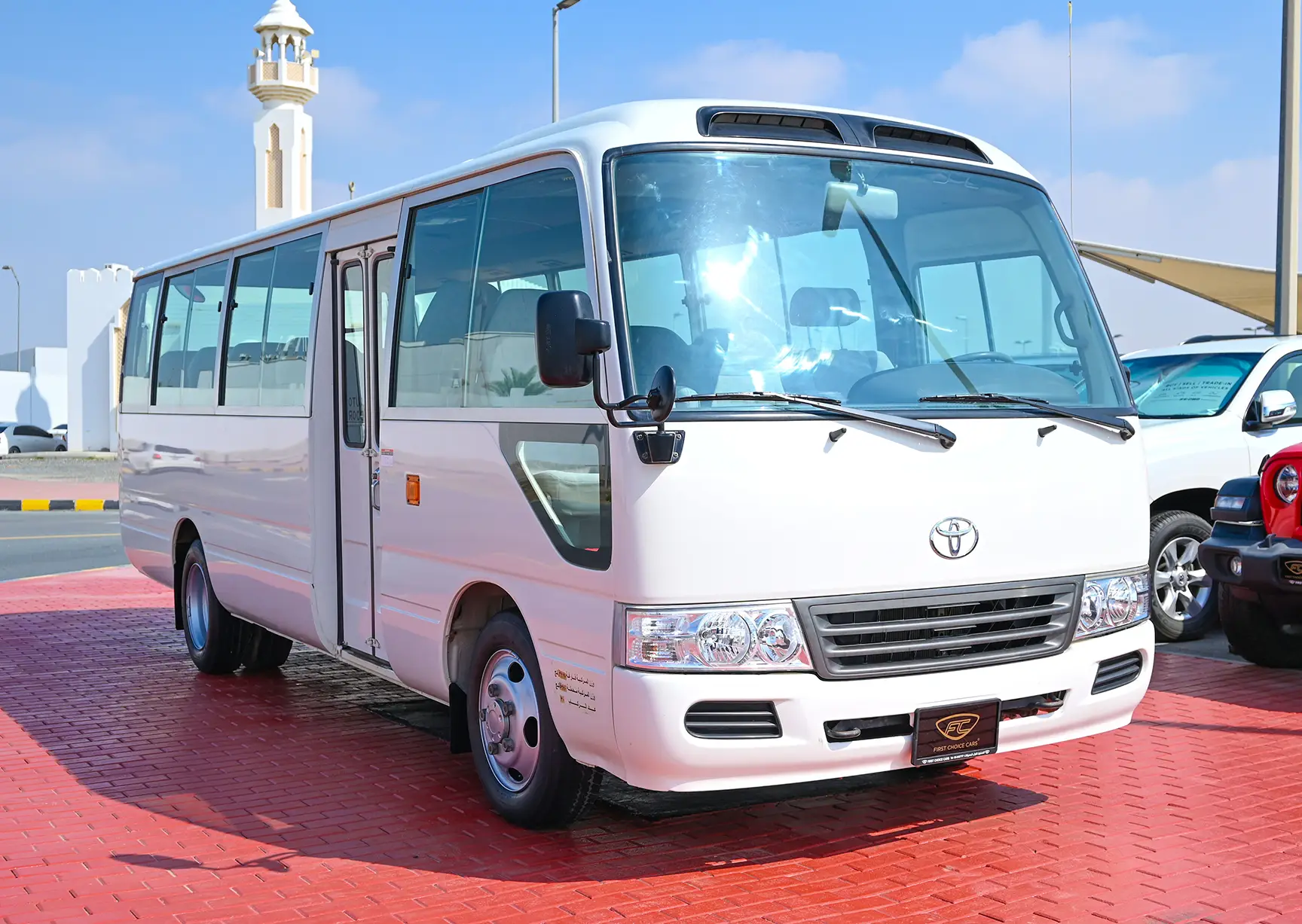 Used 2016 Toyota Coaster Dls Std Roof 30 STR 4.2L Diesel White – Right Front Diagonal (45°) View at First Choice Cars Sharjah