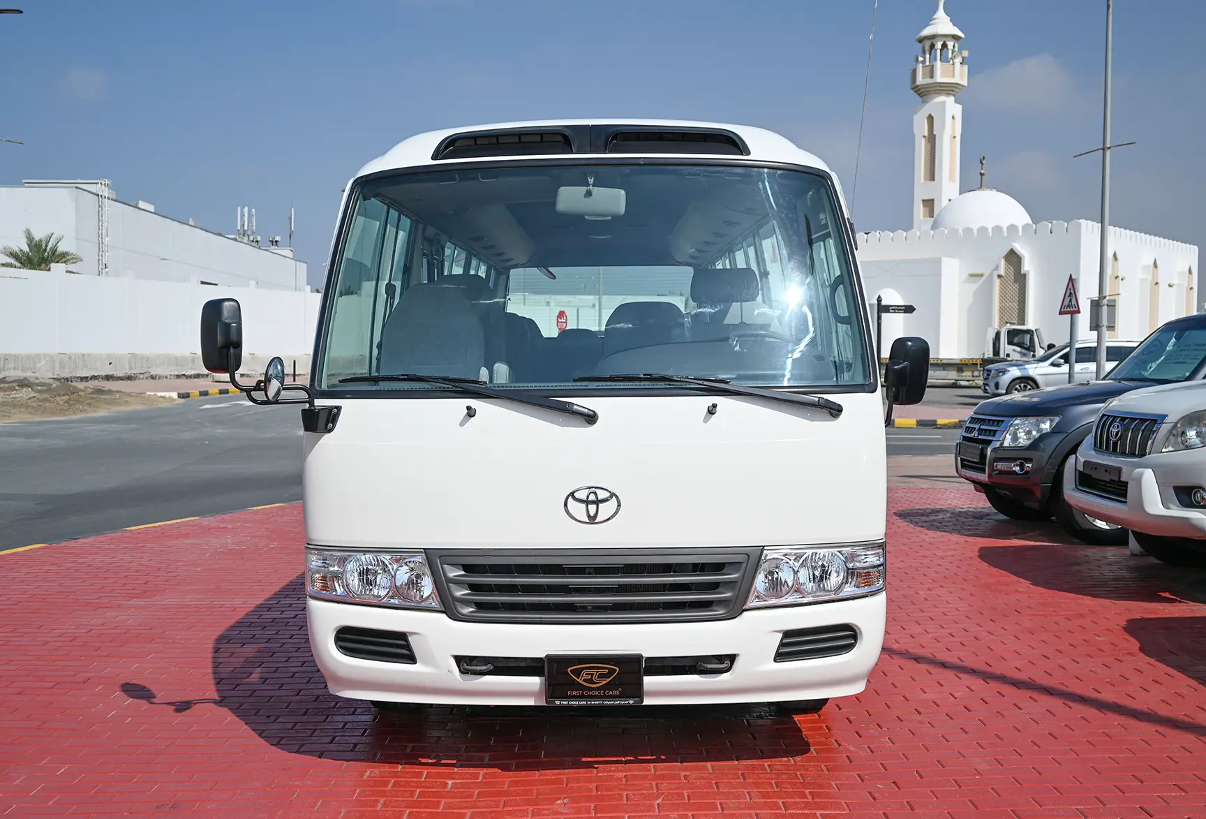 Used 2016 Toyota Coaster Dls Std Roof 30 STR 4.2L Diesel White – Front View at First Choice Cars Sharjah