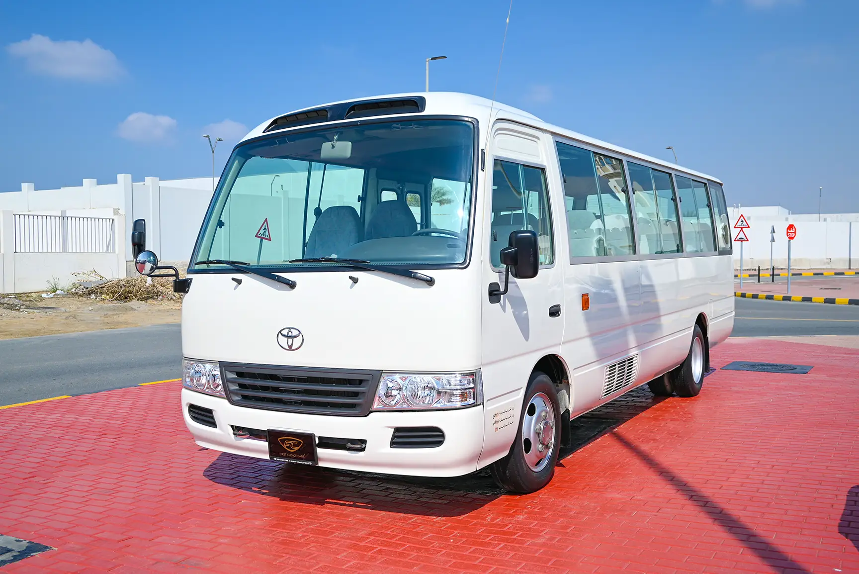 Used 2016 Toyota Coaster Dls Std Roof 30 STR 4.2L Diesel White – Left Front Diagonal (45°) View at First Choice Cars Sharjah
