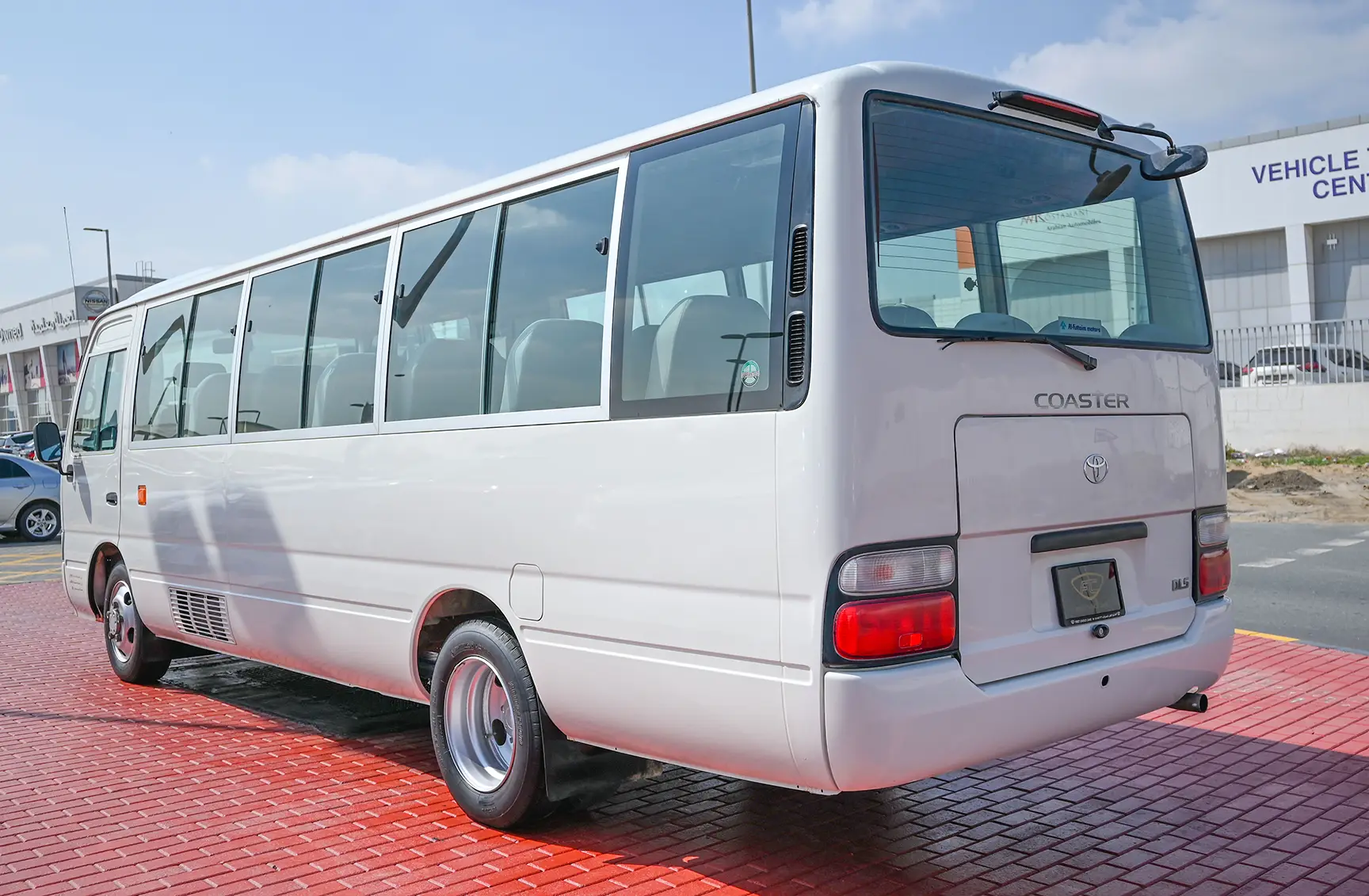 Used 2016 Toyota Coaster Standard Roof in White – Left Back Diagonal (45°) View