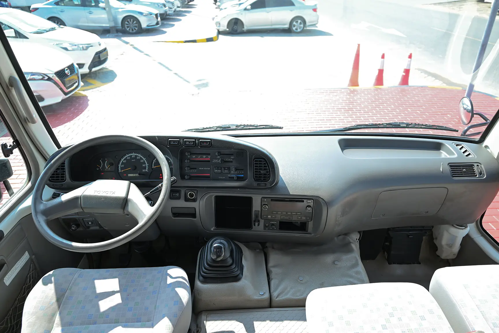 Used 2016 Toyota Coaster Standard Roof in White – Front Cabin / Dashboard Full View