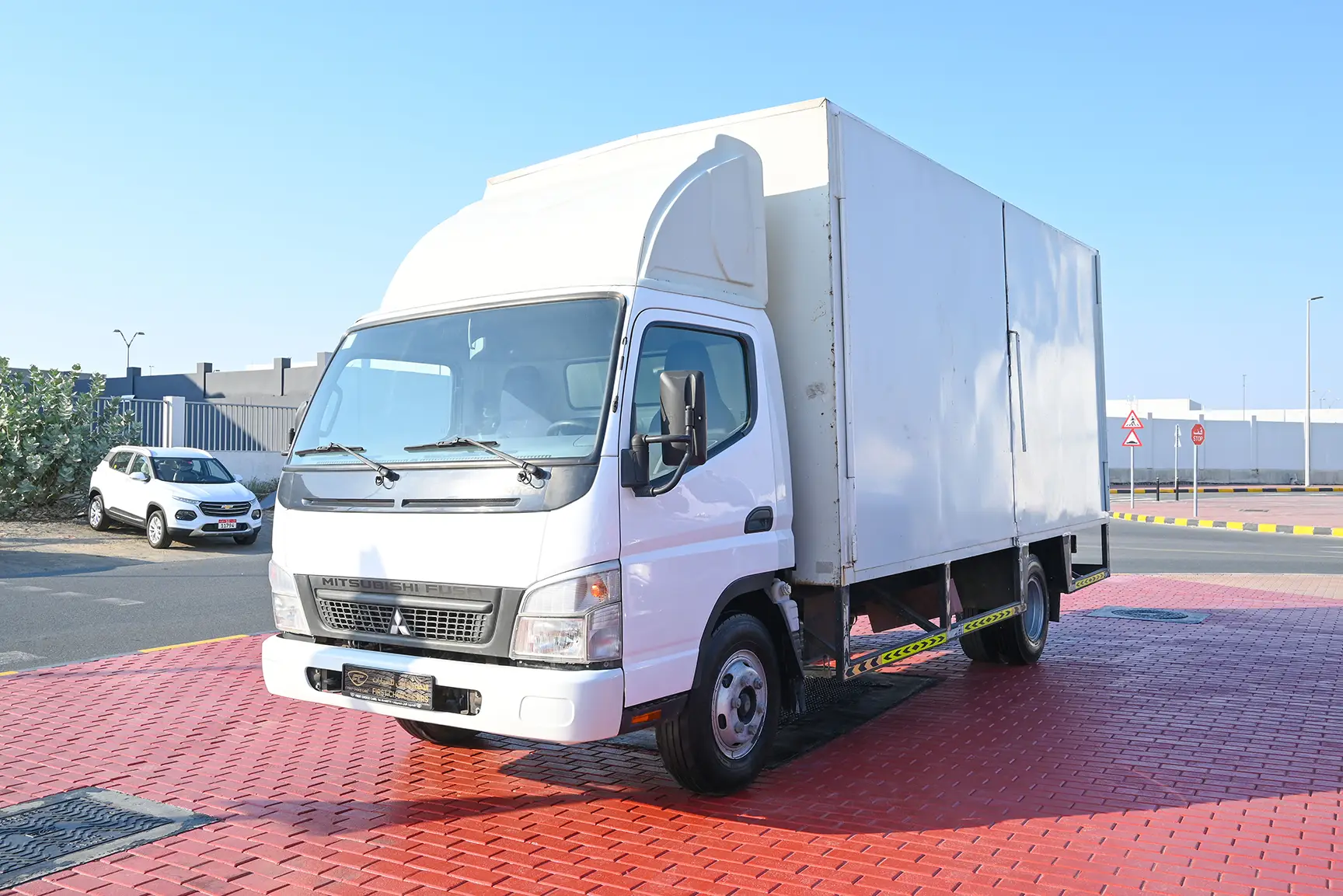 Used 2016 Mitsubishi Canter Cargo Box in White – Left Front Diagonal (45°) View for Sale at First Choice Cars Dubai Sharjah