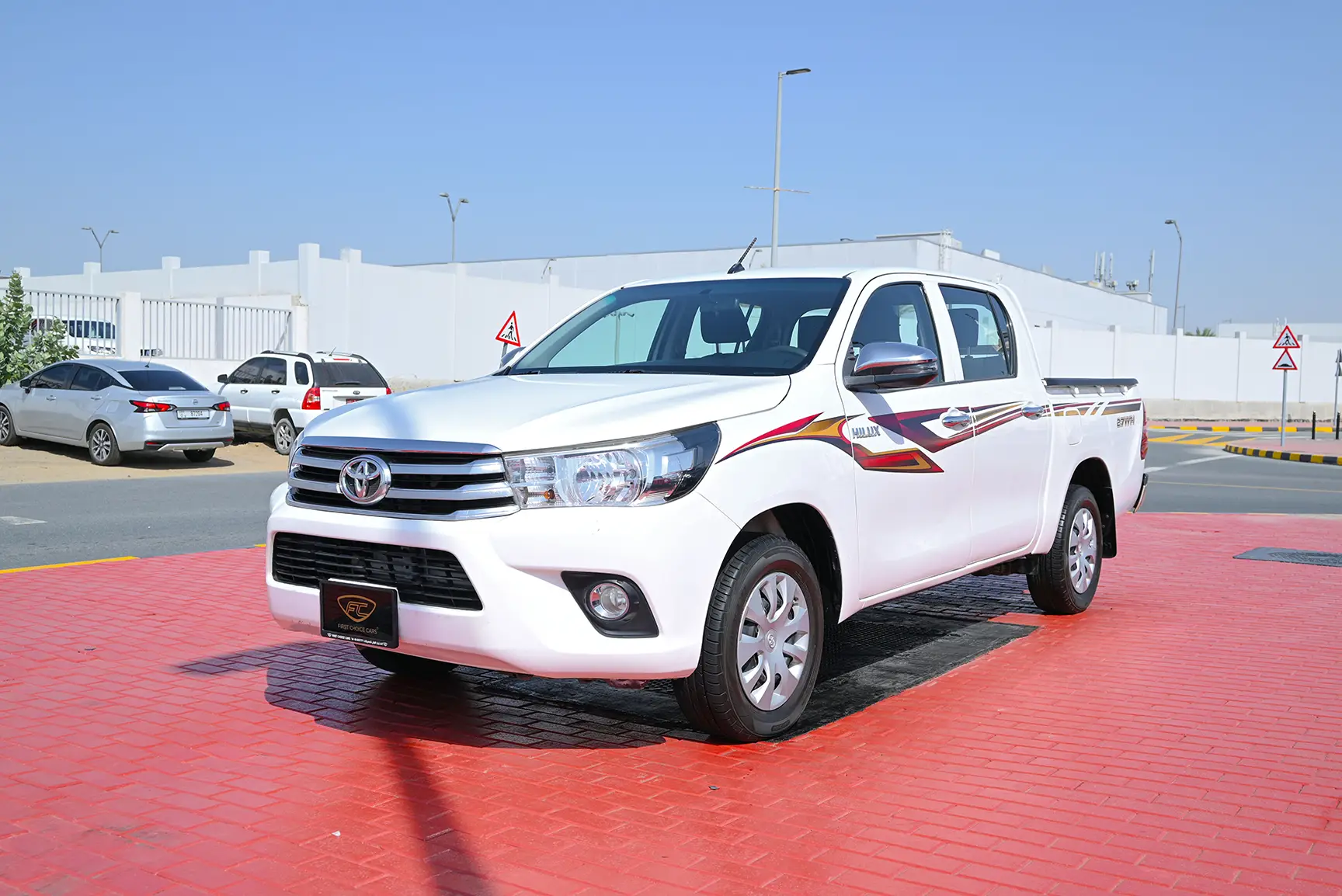 Used 2019 Toyota Hilux GLX Double Cabin White – Left Front Diagonal (45°) View at First Choice Cars Sharjah