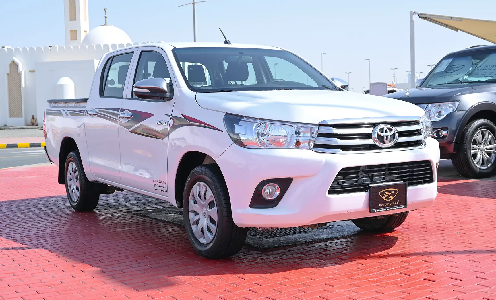 Used 2019 Toyota Hilux GLX Double Cabin White – Right Front Diagonal (45°) View at First Choice Cars Sharjah