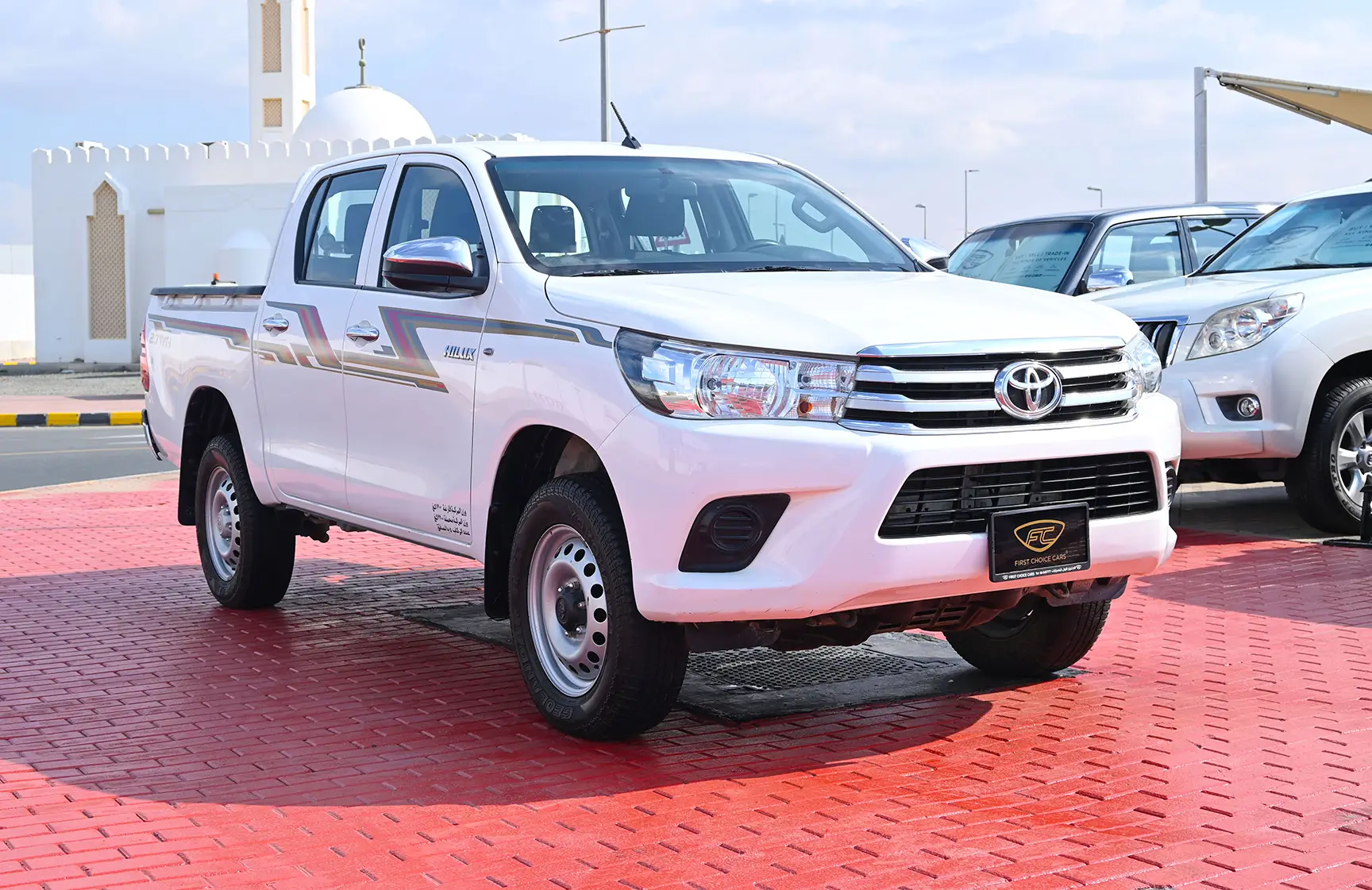 Used 2020 Toyota Hilux GL Double Cabin White – Right Front Diagonal (45°) View at First Choice Cars Sharjah