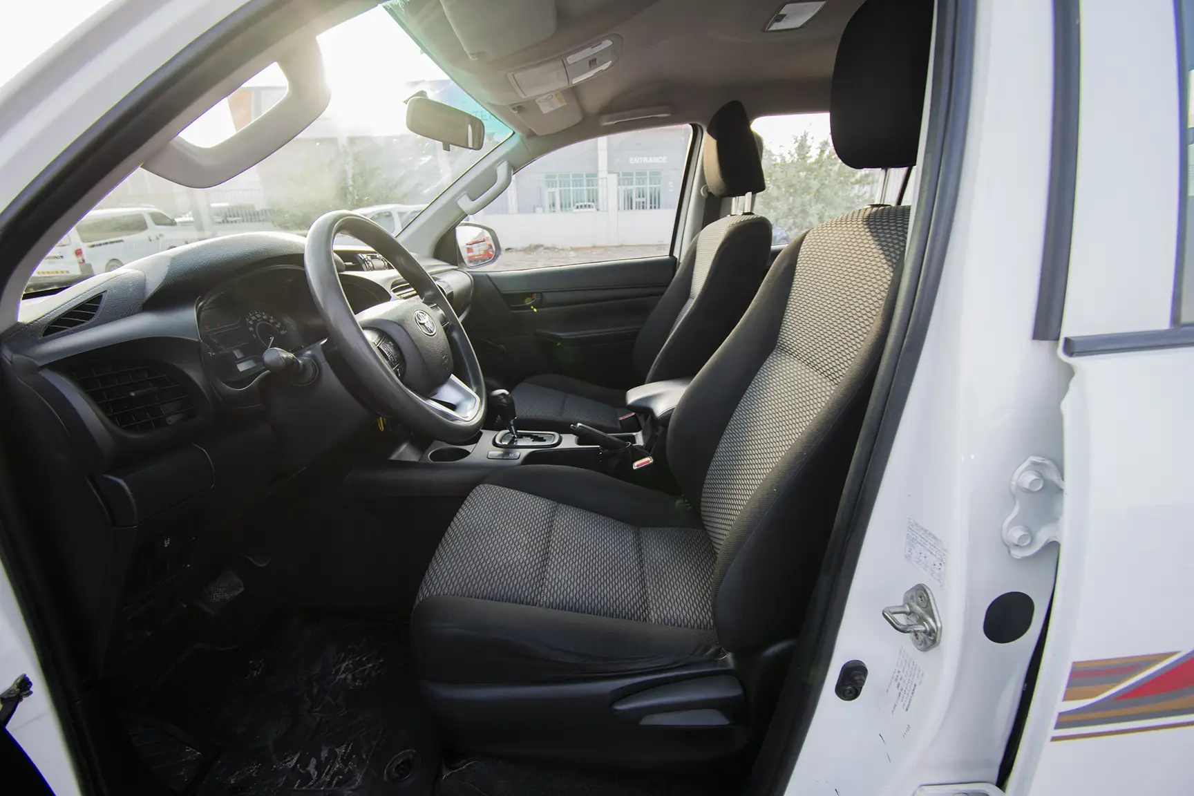 Used 2020 Toyota Hilux GL Double Cabin White – Front Driver Side Cabin View at First Choice Cars Sharjah