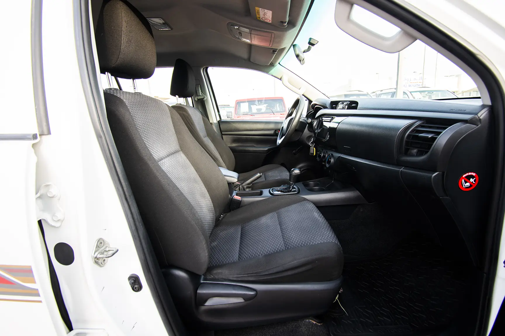 Used 2020 Toyota Hilux GL Double Cabin White – Front Passenger Side Cabin View at First Choice Cars Sharjah
