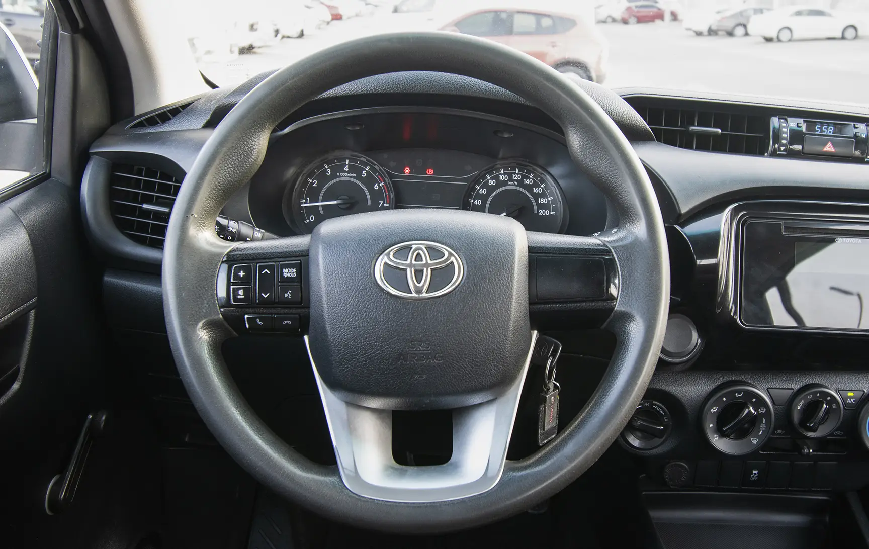 Used 2020 Toyota Hilux GL Double Cabin White – Driver Side Dashboard & Steering View at First Choice Cars Sharjah
