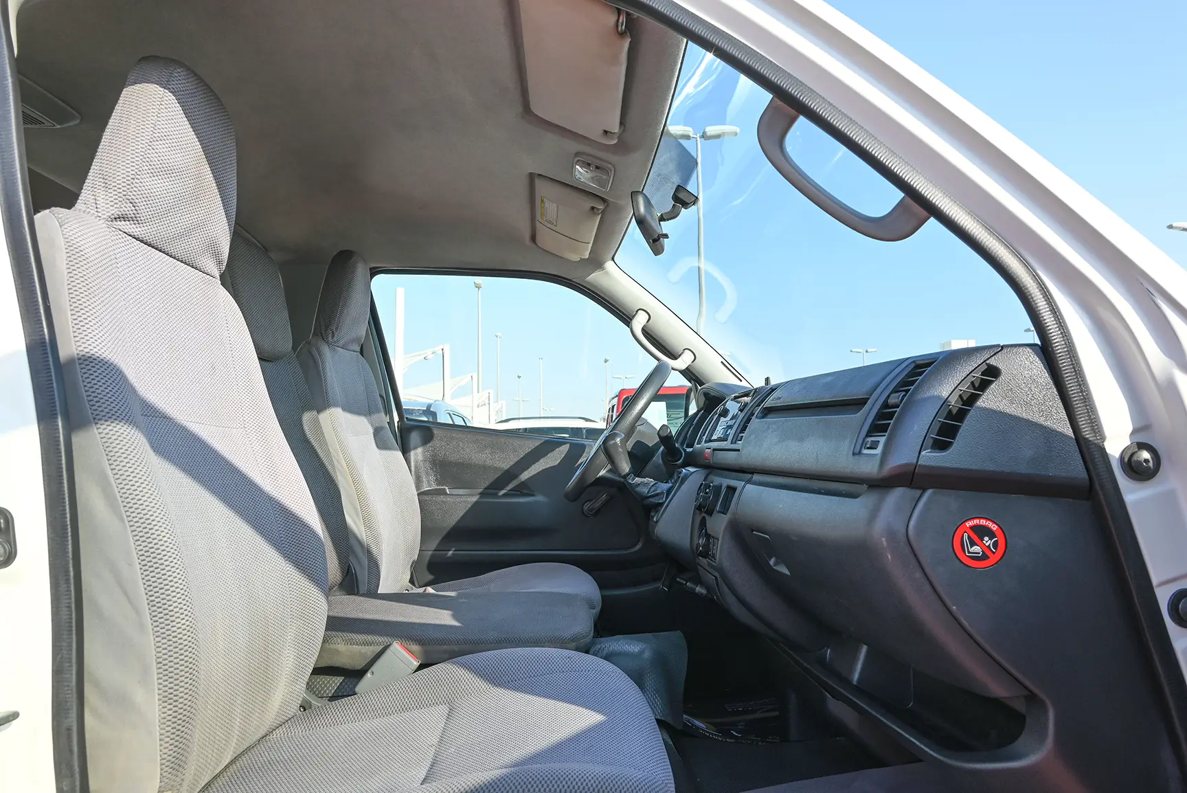 Used 2015 Toyota Hiace GL Standard Roof White – Front Passenger Side Cabin View at First Choice Cars Sharjah