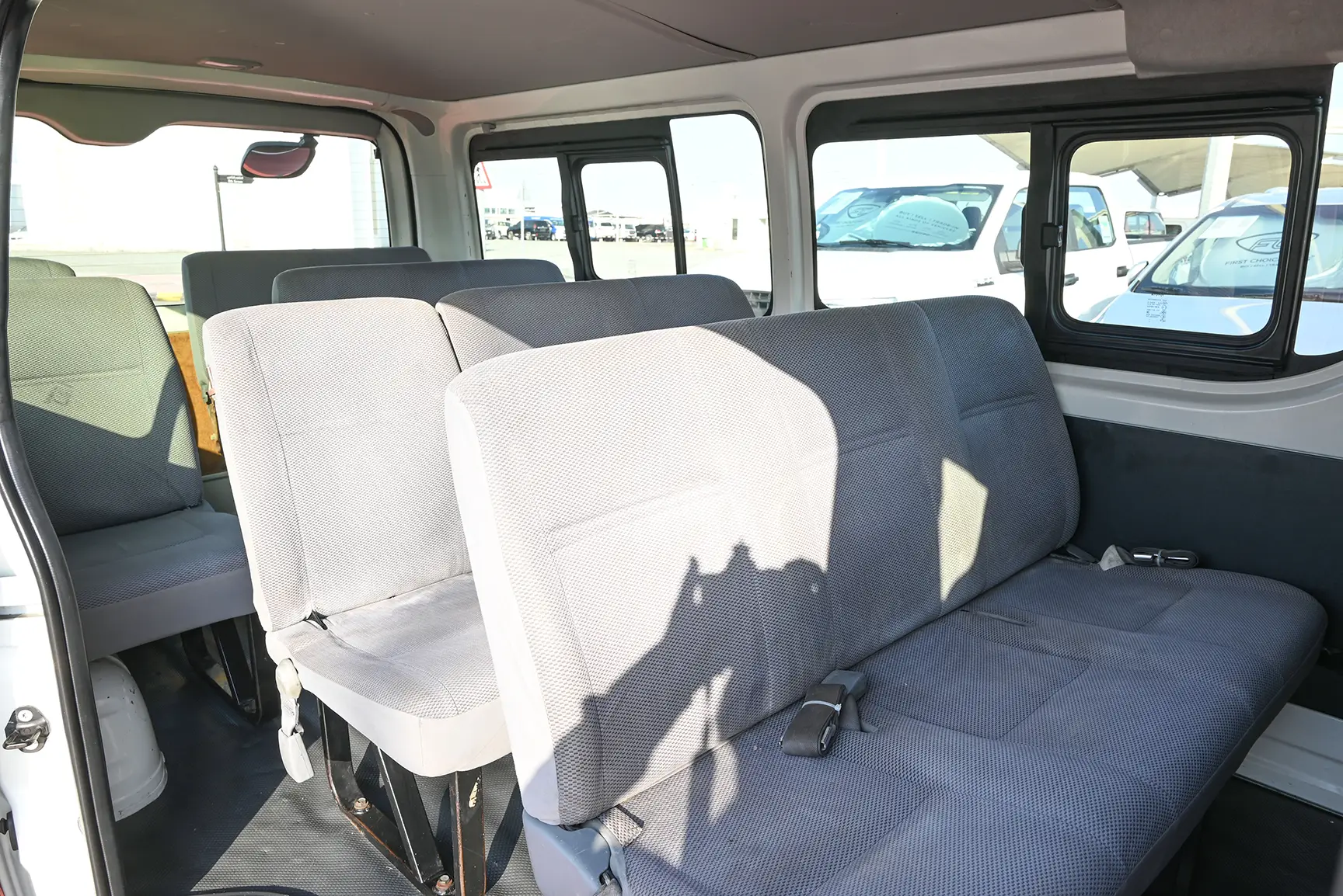 Used 2015 Toyota Hiace GL Standard Roof White – Rear Passenger Side Cabin View at First Choice Cars Sharjah