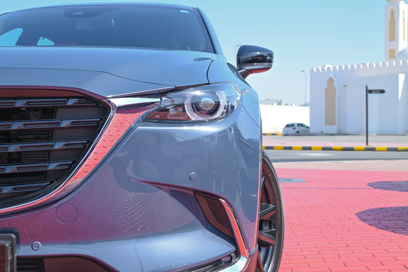 Used 2022 Mazda CX-9 Ignite Edition Blue – Headlight Close-up at First Choice Cars Sharjah