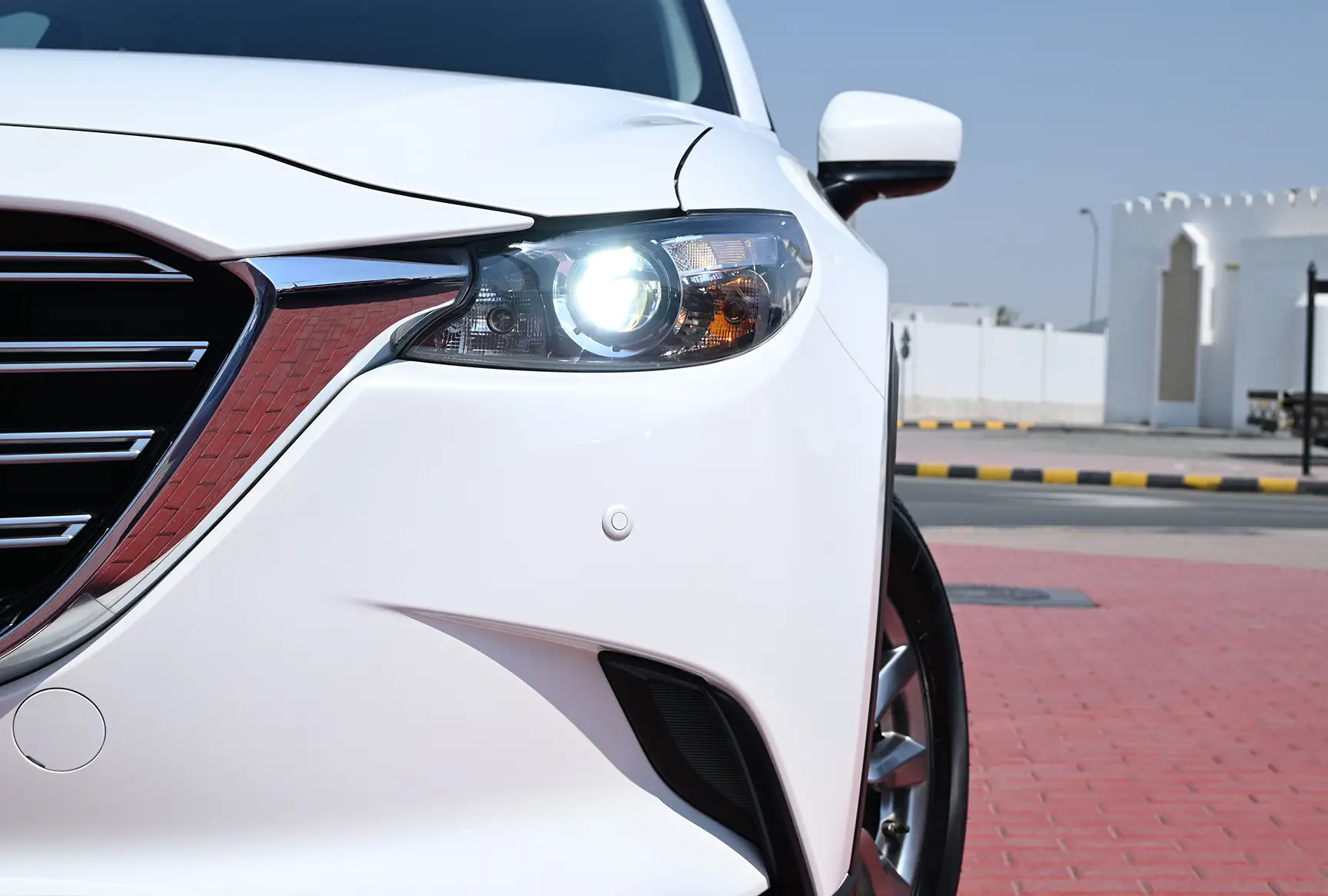 Used 2020 Mazda CX-9 GT White – Headlight Close-up at First Choice Cars Sharjah