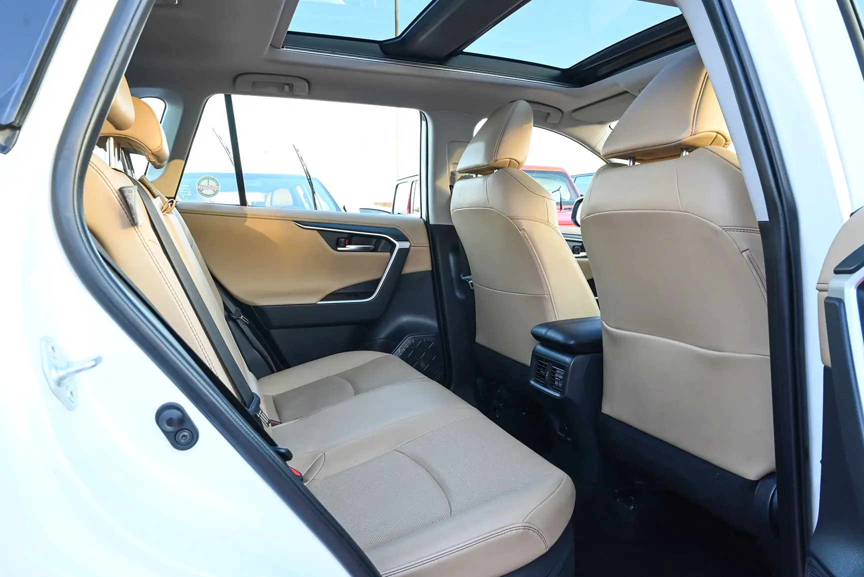 Used 2019 Toyota RAV4 VXR White – Rear Passenger Side Cabin View at First Choice Cars Sharjah