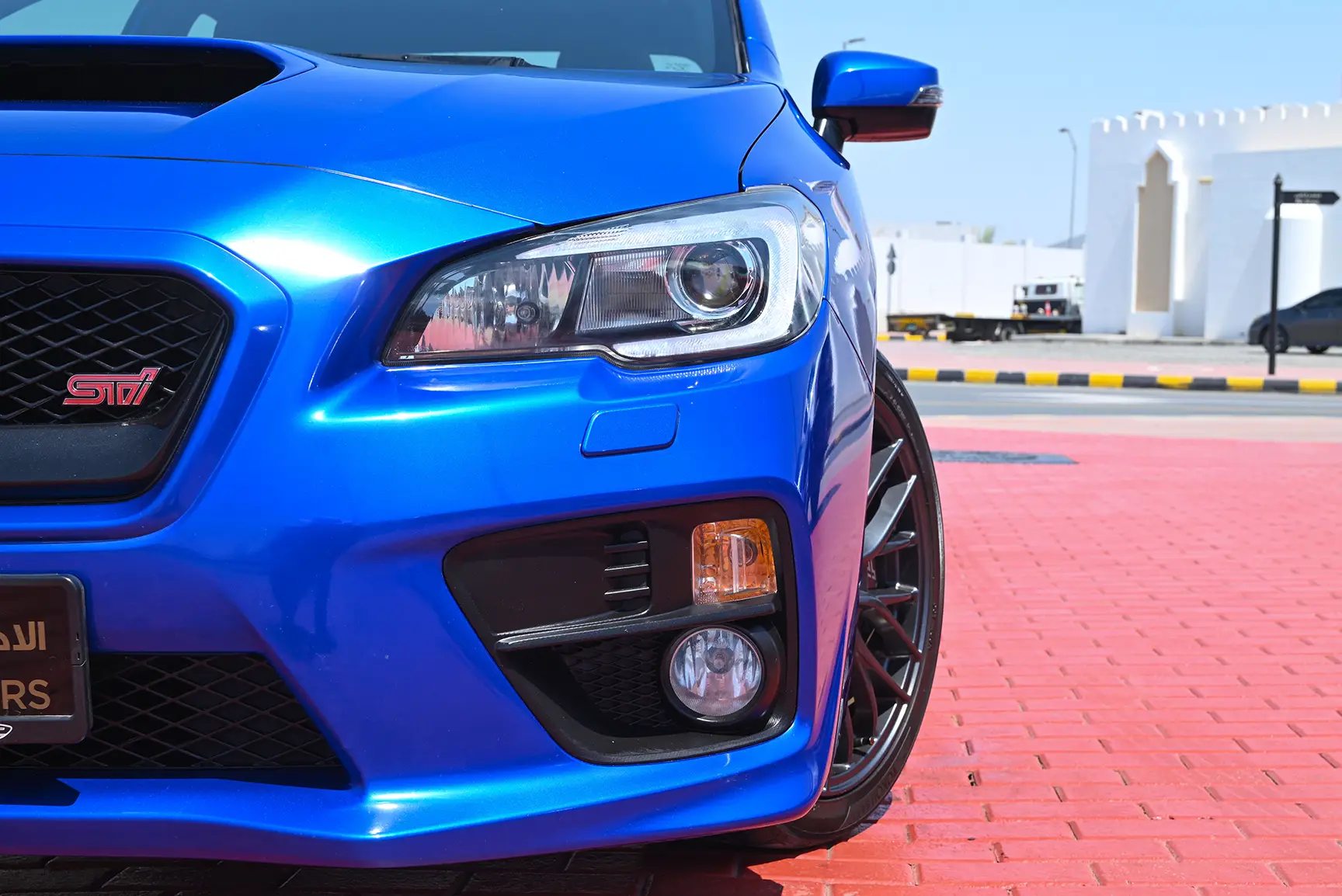 Used 2017 Subaru WRX Sti Blue – Headlight Close-up at First Choice Cars Sharjah