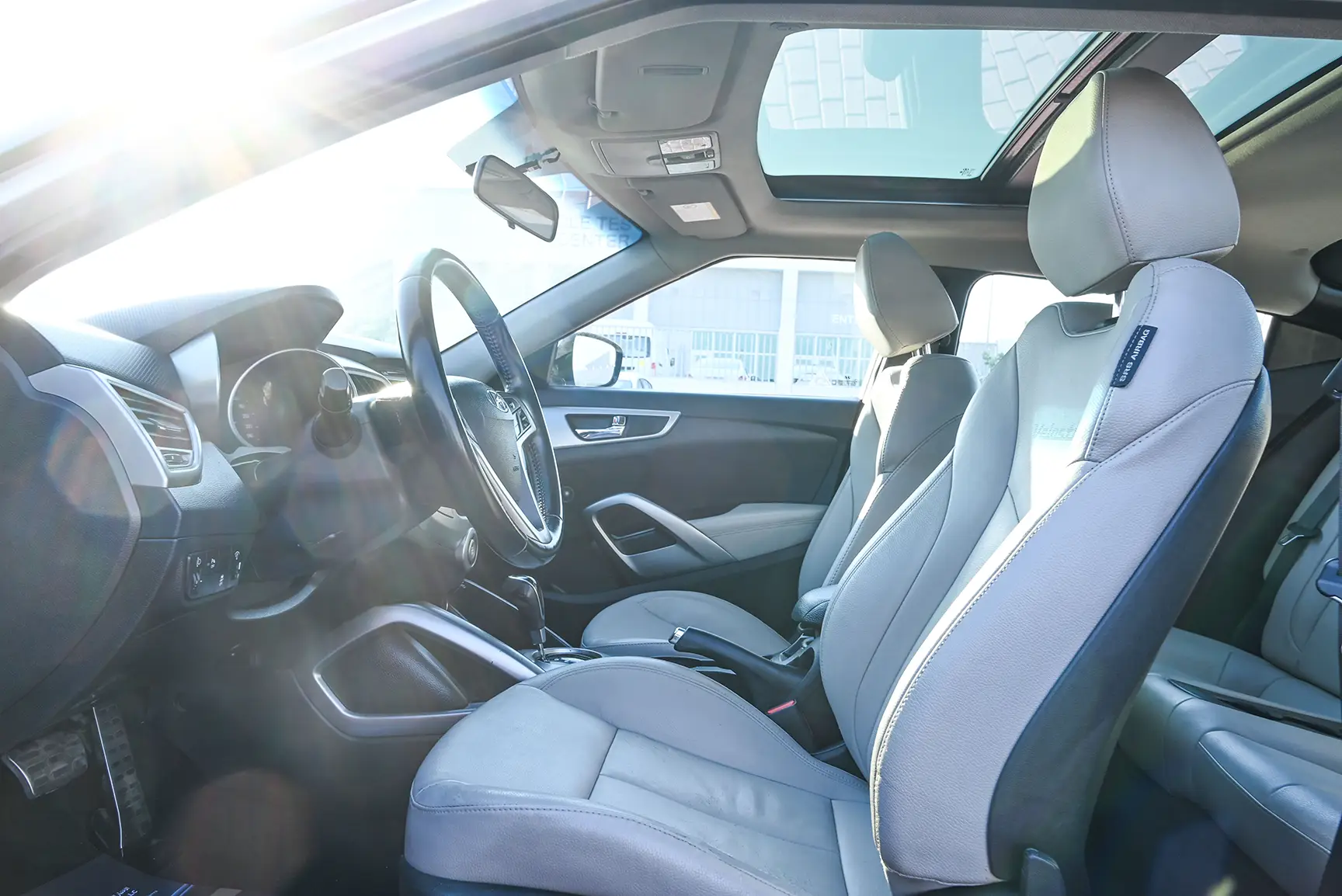 Used 2015 Hyundai Veloster GL Silver – Front Driver Side Cabin View at First Choice Cars Sharjah