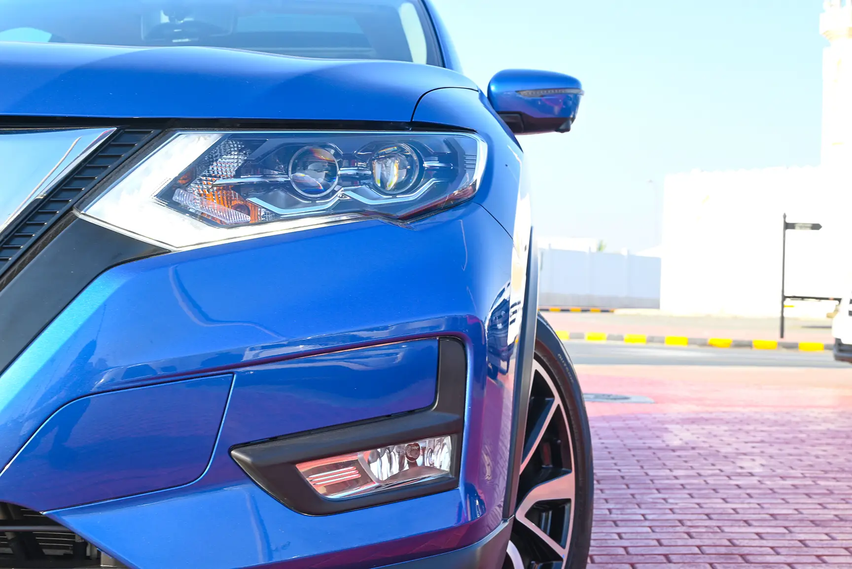 Used 2020 Nissan X-Trail Sl Blue – Headlight Close-up at First Choice Cars Sharjah