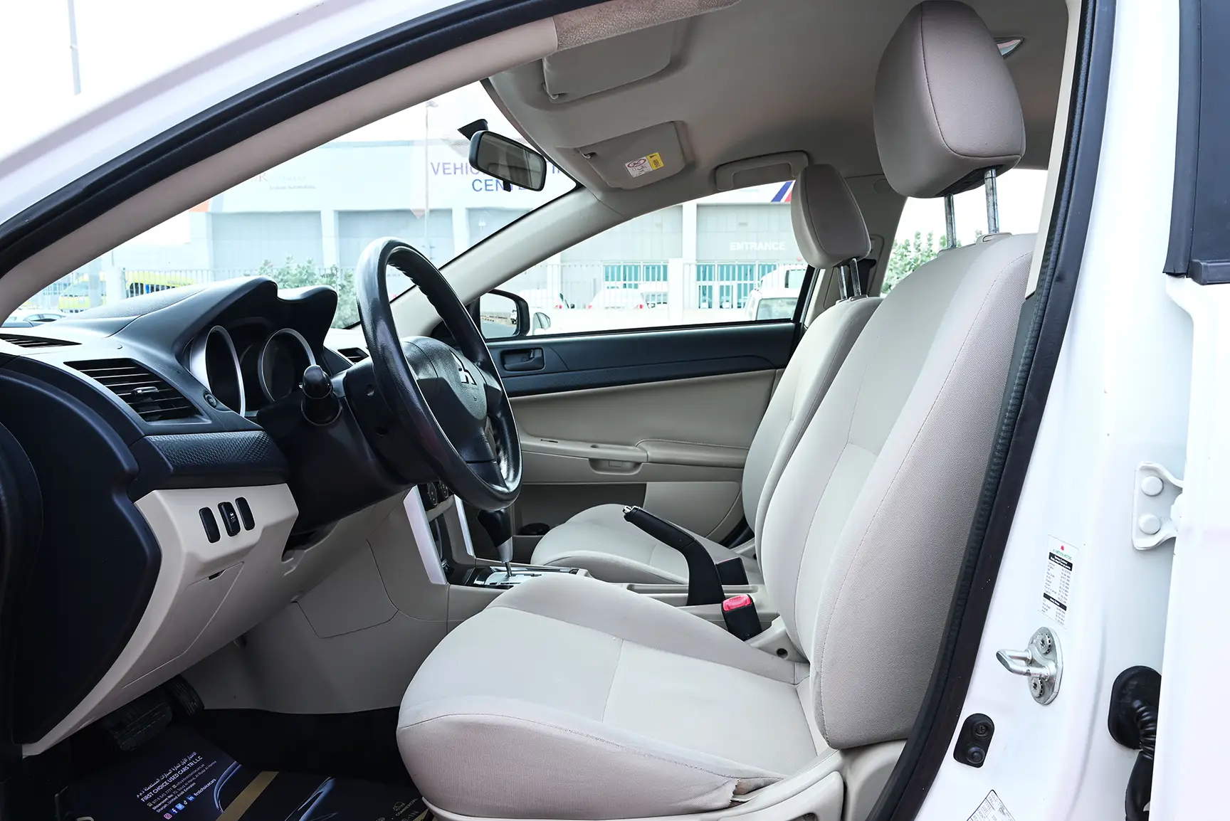 Used 2017 Mitsubishi LANCER EX GLX White – Front Driver Side Cabin View at First Choice Cars Sharjah