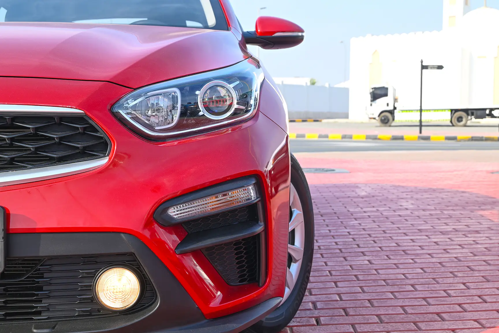Used 2020 KIA Cerato Lx Red – Headlight Close-up at First Choice Cars Sharjah