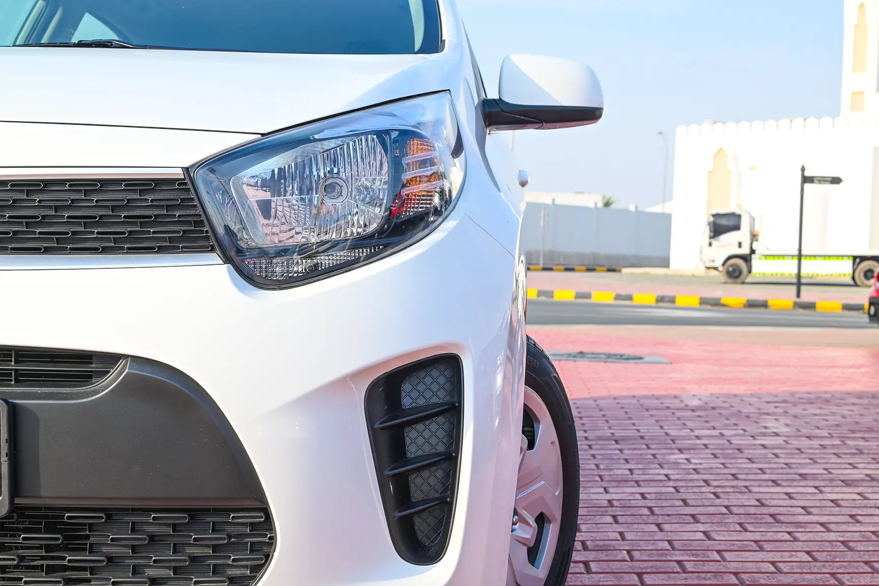 Used 2020 Kia Picanto EX in White – Headlight Close-up for Sale at First Choice Cars Dubai Sharjah