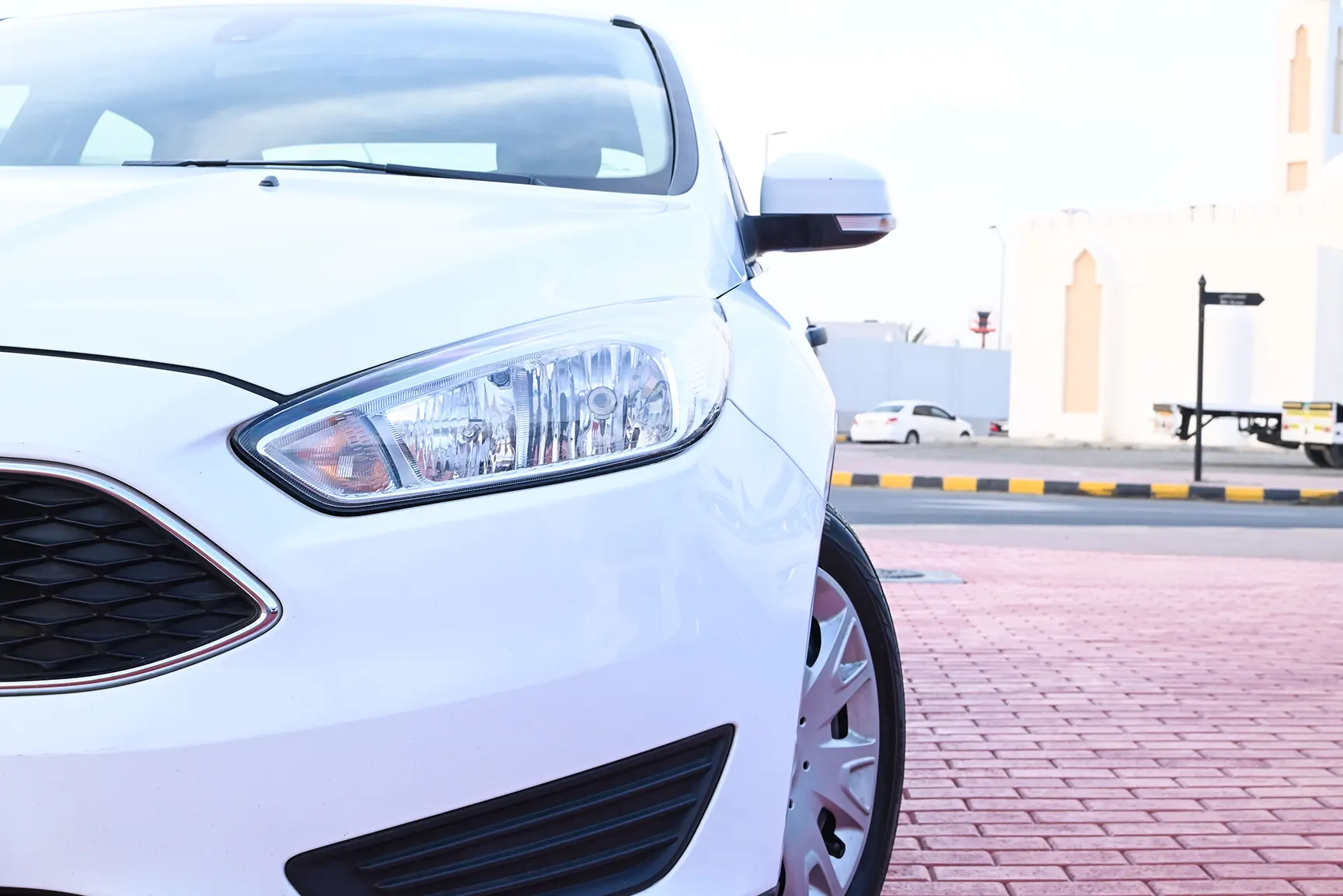 Used 2018 Ford Focus S White – Headlight Close-up at First Choice Cars Sharjah