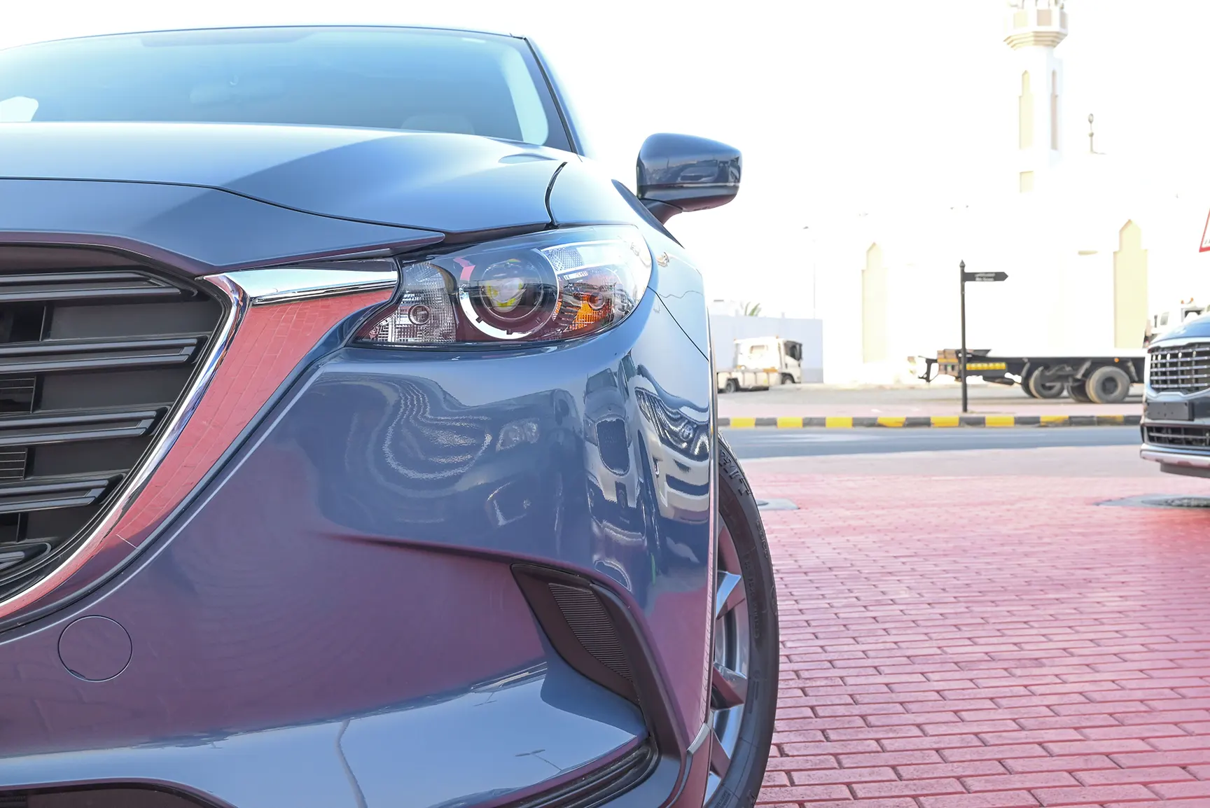 Used 2022 Mazda CX-9 GT Blue – Headlight Close-up at First Choice Cars Sharjah