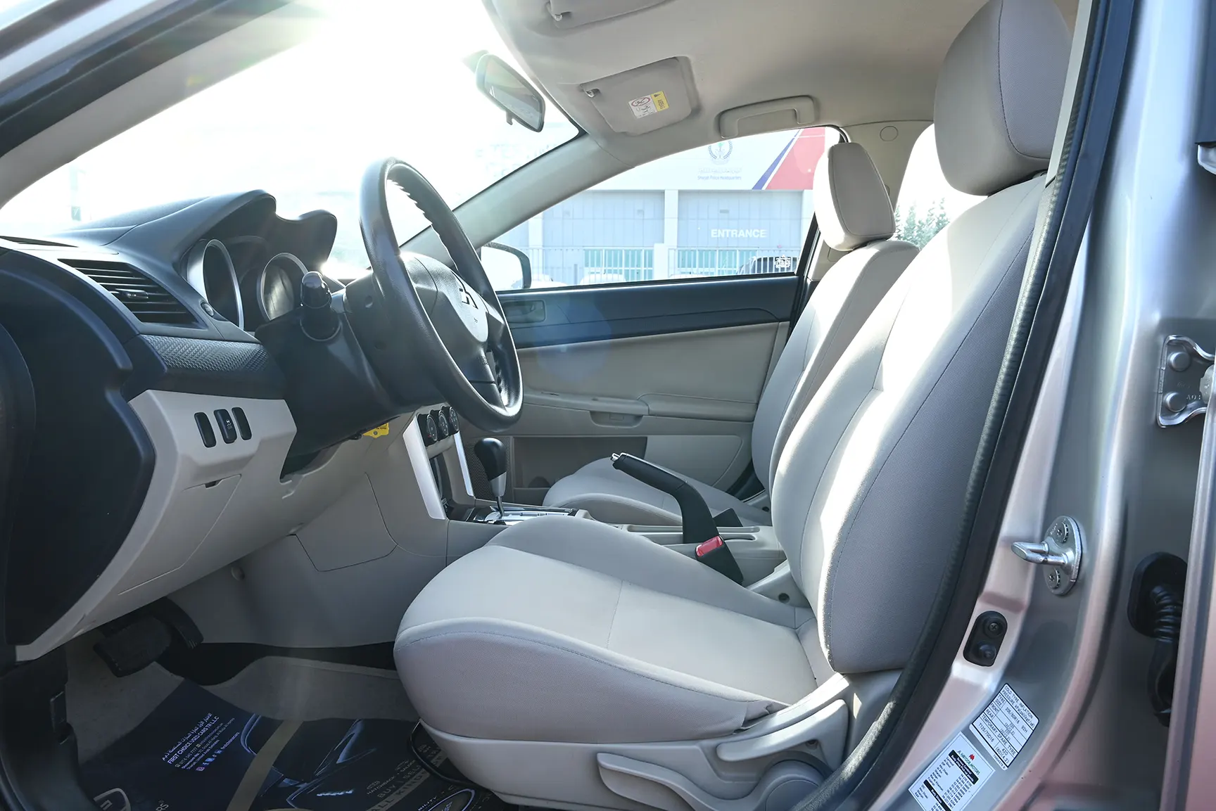 Used 2017 Mitsubishi LANCER EX GLS White – Front Driver Side Cabin View at First Choice Cars Sharjah