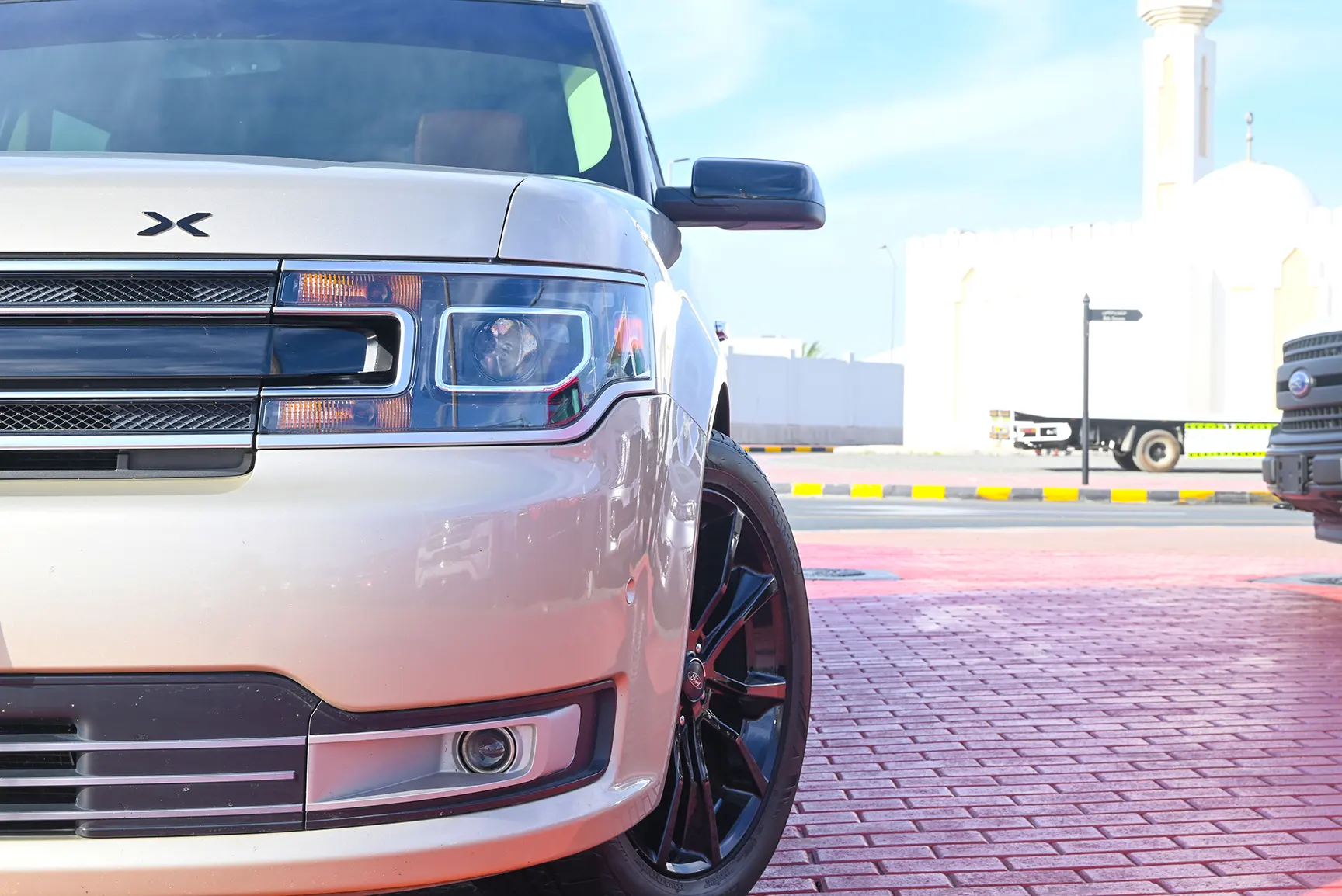 Used 2017 Ford Flex Limited in White – Headlight Close-up for Sale at First Choice Cars Dubai Sharjah