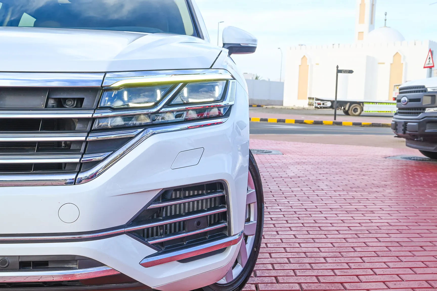 Used 2018 Volkswagen Touareg Atmosphere Highline White – Headlight Close-up at First Choice Cars Sharjah