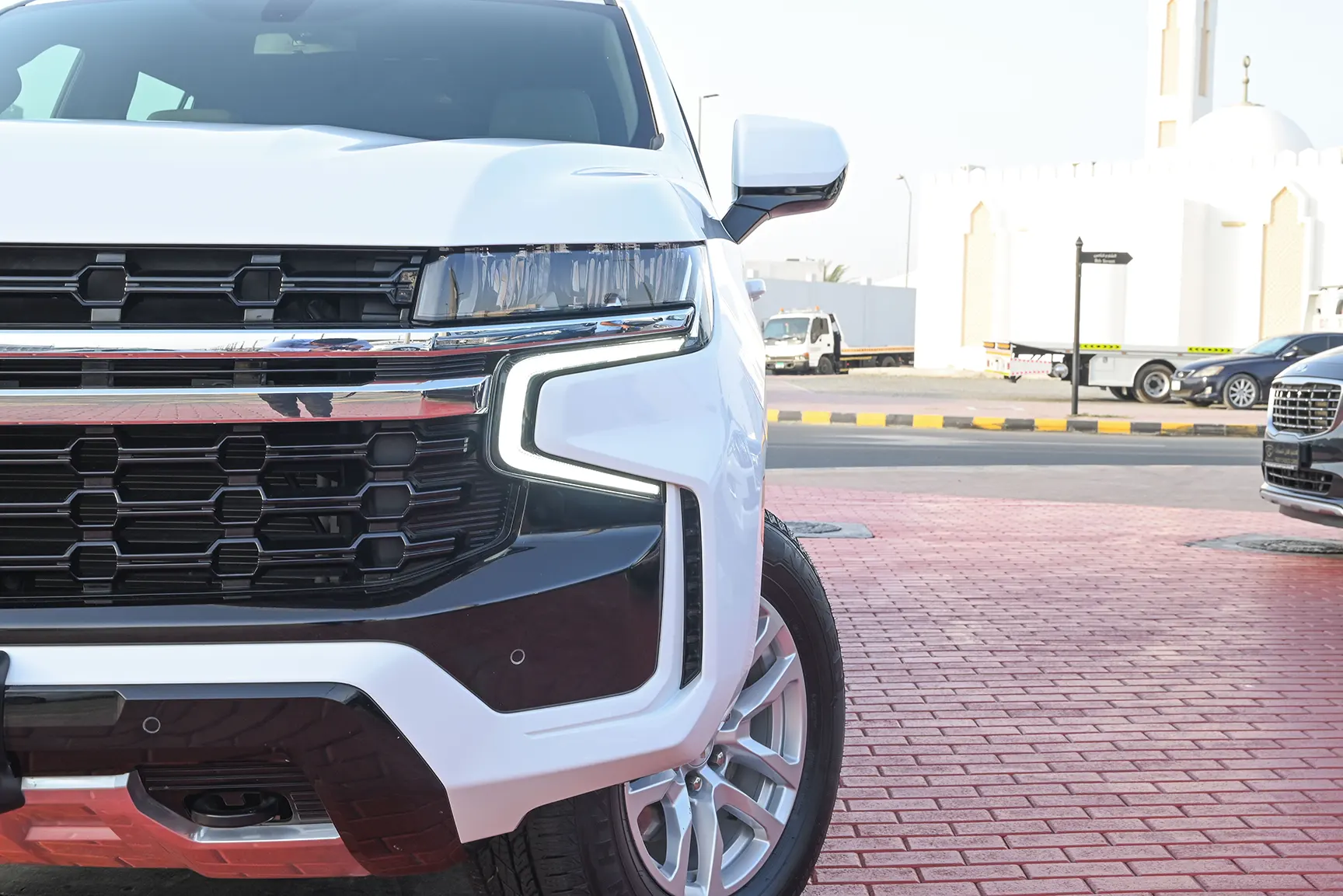 Used 2021 Chevrolet Tahoe LS White – Headlight Close-up at First Choice Cars Sharjah