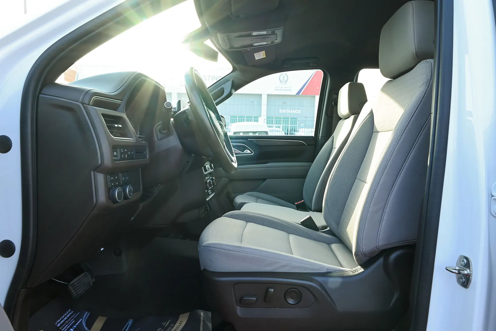 Used 2021 Chevrolet Tahoe LS White – Front Driver Side Cabin View at First Choice Cars Sharjah