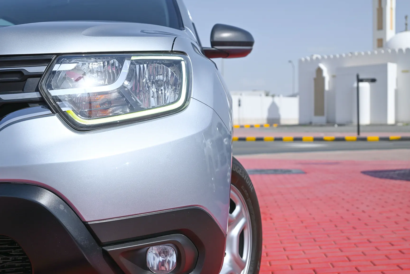 Used 2020 Renault Duster Se White – Headlight Close-up at First Choice Cars Sharjah