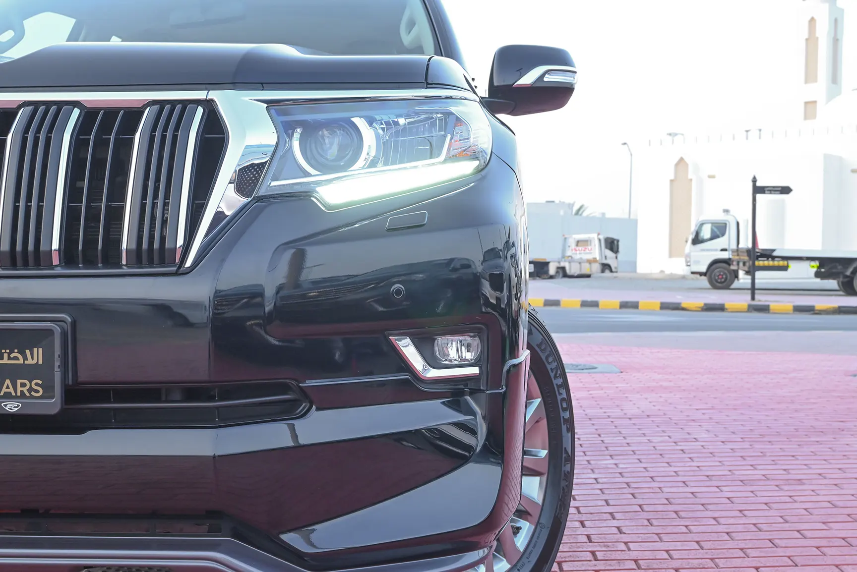 Used 2019 Toyota Prado VXR Black – Headlight Close-up at First Choice Cars Sharjah