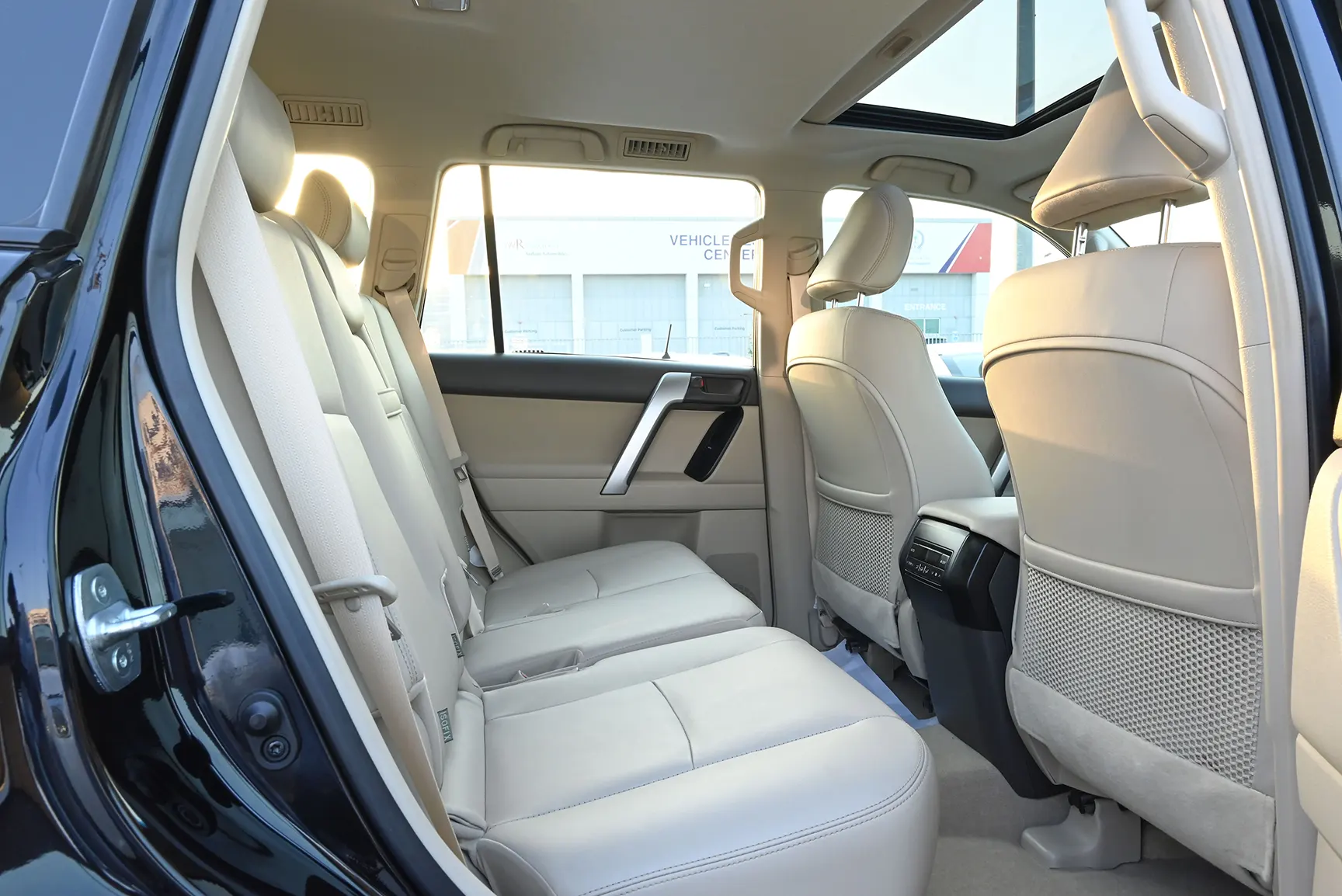 Used 2019 Toyota Prado VXR Black – Rear Passenger Side Cabin View at First Choice Cars Sharjah