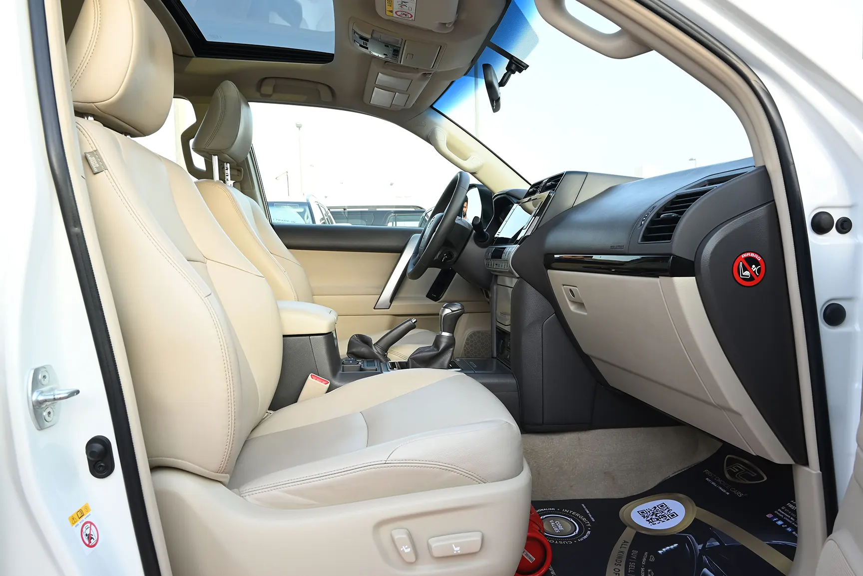 Used 2019 Toyota Prado VXR White – Front Passenger Side Cabin View at First Choice Cars Sharjah