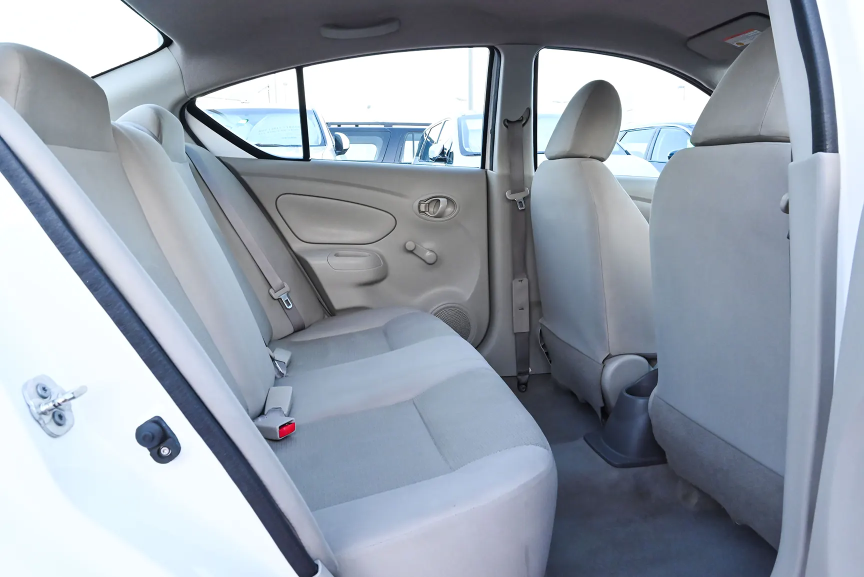 Used 2017 Nissan Sunny S White – Rear Passenger Side Cabin View at First Choice Cars Sharjah