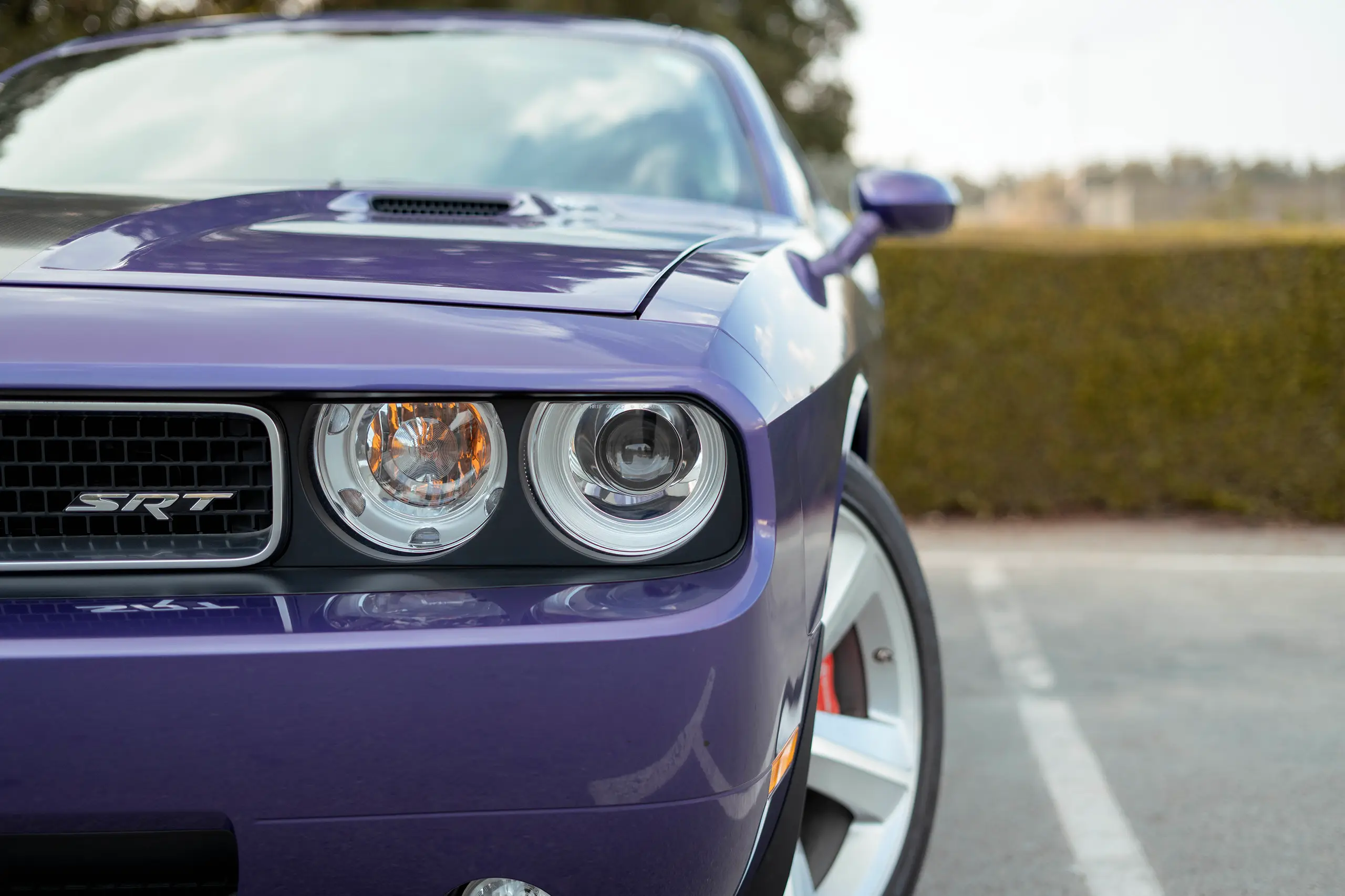 Used 2010 Dodge Challenger SRT8 in Purple – Headlight Close-up for Sale at First Choice Cars Dubai Sharjah