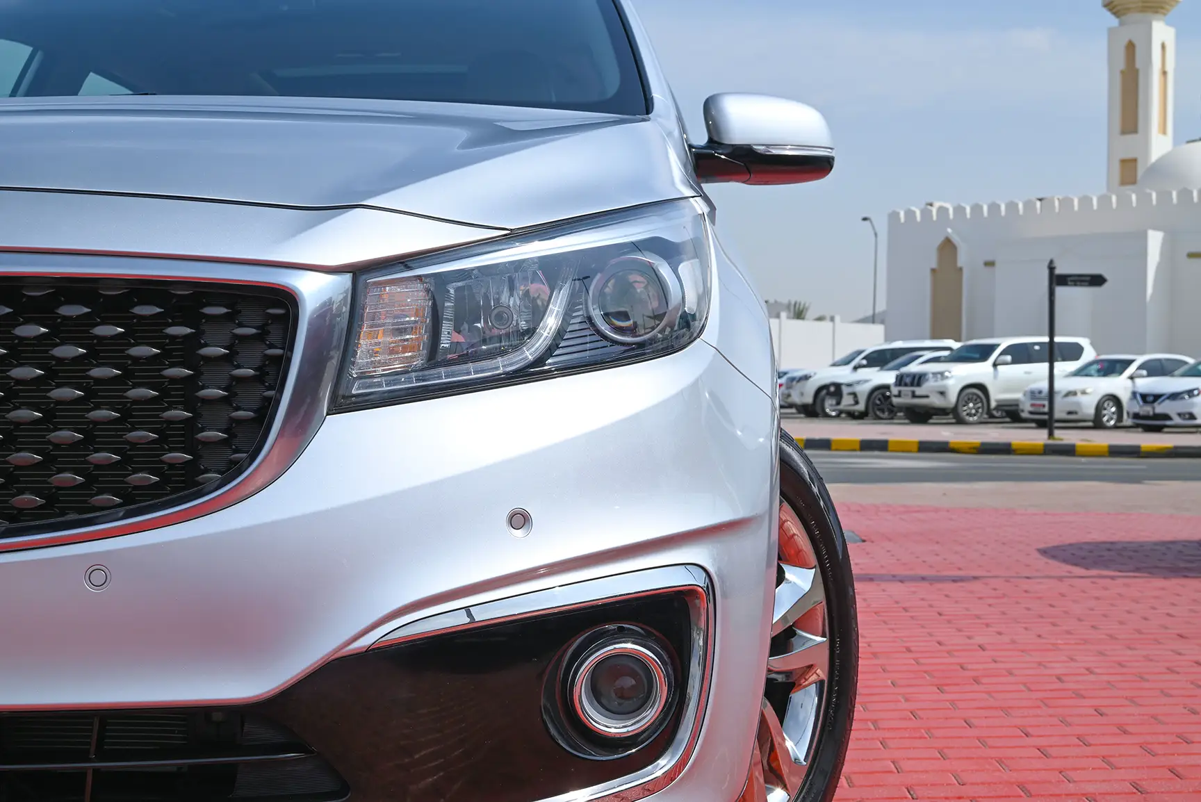 Used 2017 KIA Carnival Grand Carnival Silver – Headlight Close-up at First Choice Cars Sharjah