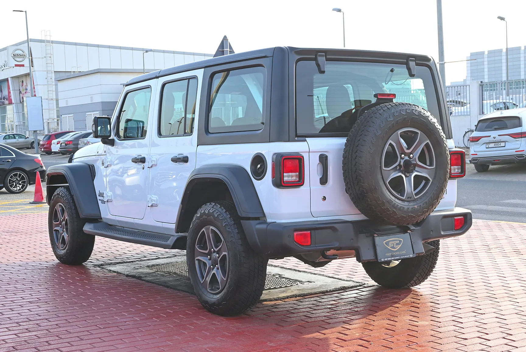 Used 2019 Jeep Wrangler Unlimited Sport White – Left Back Diagonal (45°) View at First Choice Cars Sharjah