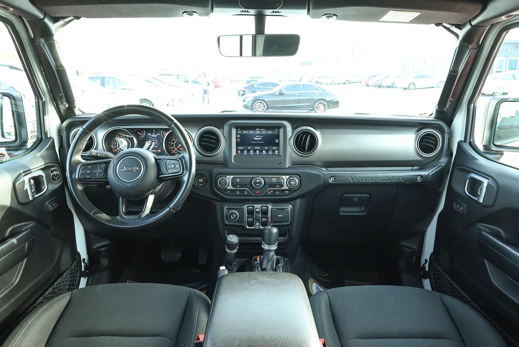 Used 2019 Jeep Wrangler Unlimited Sport White – Front Cabin / Dashboard Full View at First Choice Cars Sharjah