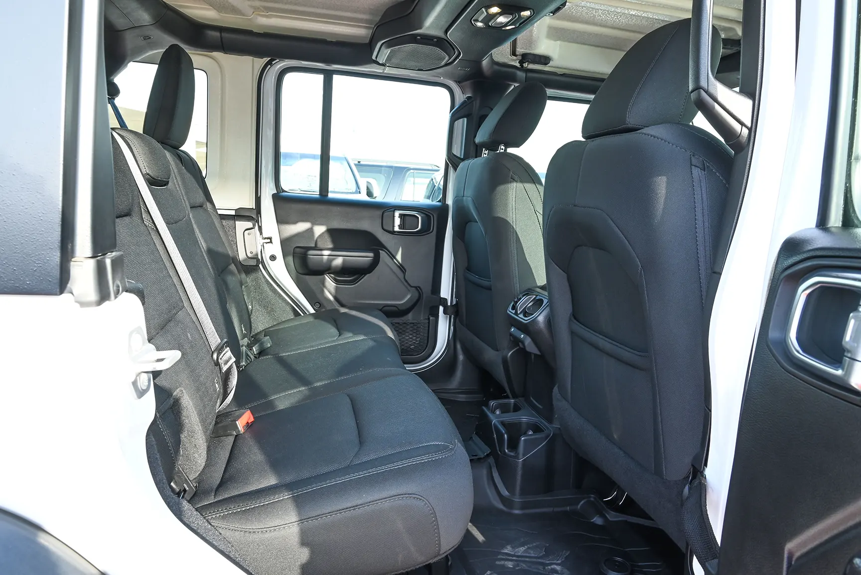 Used 2019 Jeep Wrangler Unlimited Sport White – Rear Passenger Side Cabin View at First Choice Cars Sharjah